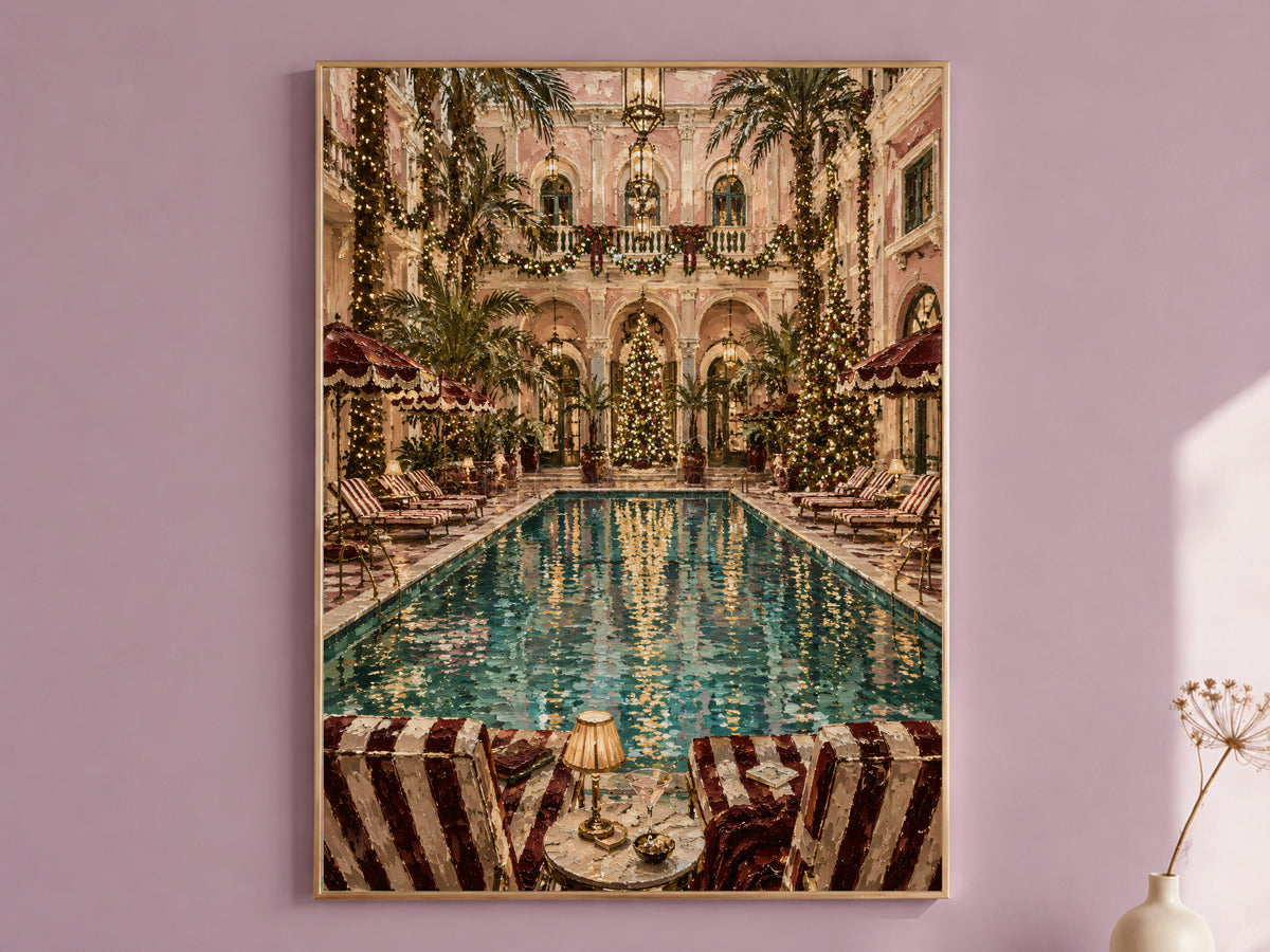 Grand hotel Christmas wall art print of an indoor palm court pool framed in gold, hung on a dusty mauve wall