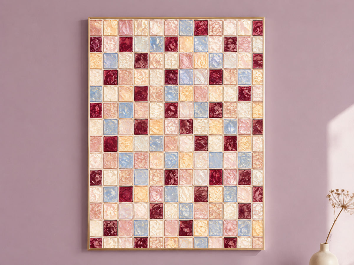 Pink blue mosaic wall art print in a thin gold frame hanging on a mauve wall, styled with a small vase of dried flowers