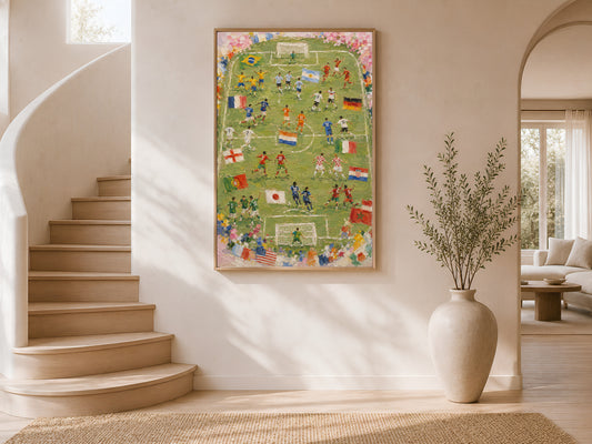 World Cup 2026 football pitch impasto print in a thin wood frame displayed in a bright airy stairwell interior with white curved walls, warm natural light, and large ceramic vases
