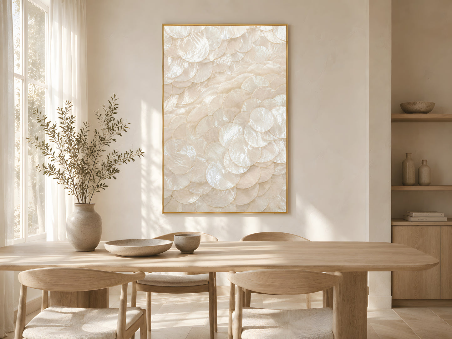 Capiz shell spiral swirl print in gold frame above wooden dining table in warm minimalist living room with dried botanicals and soft natural light

