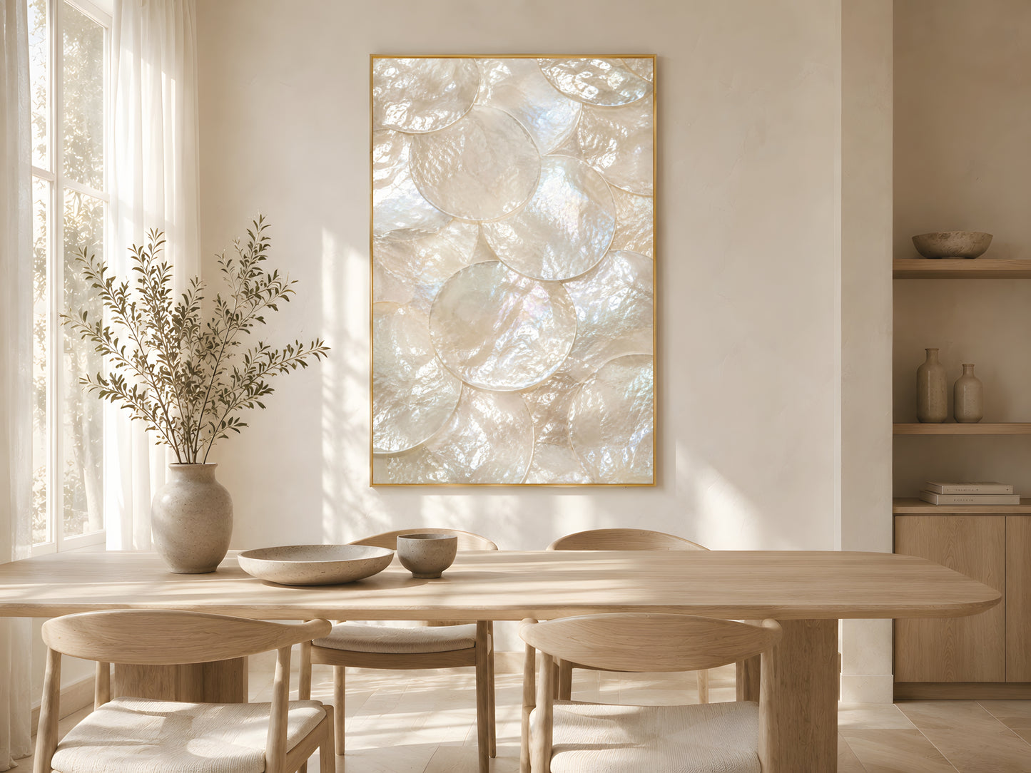 Mother of pearl shell print in gold frame above wooden dining table in warm minimalist living room with dried botanicals and soft natural light


