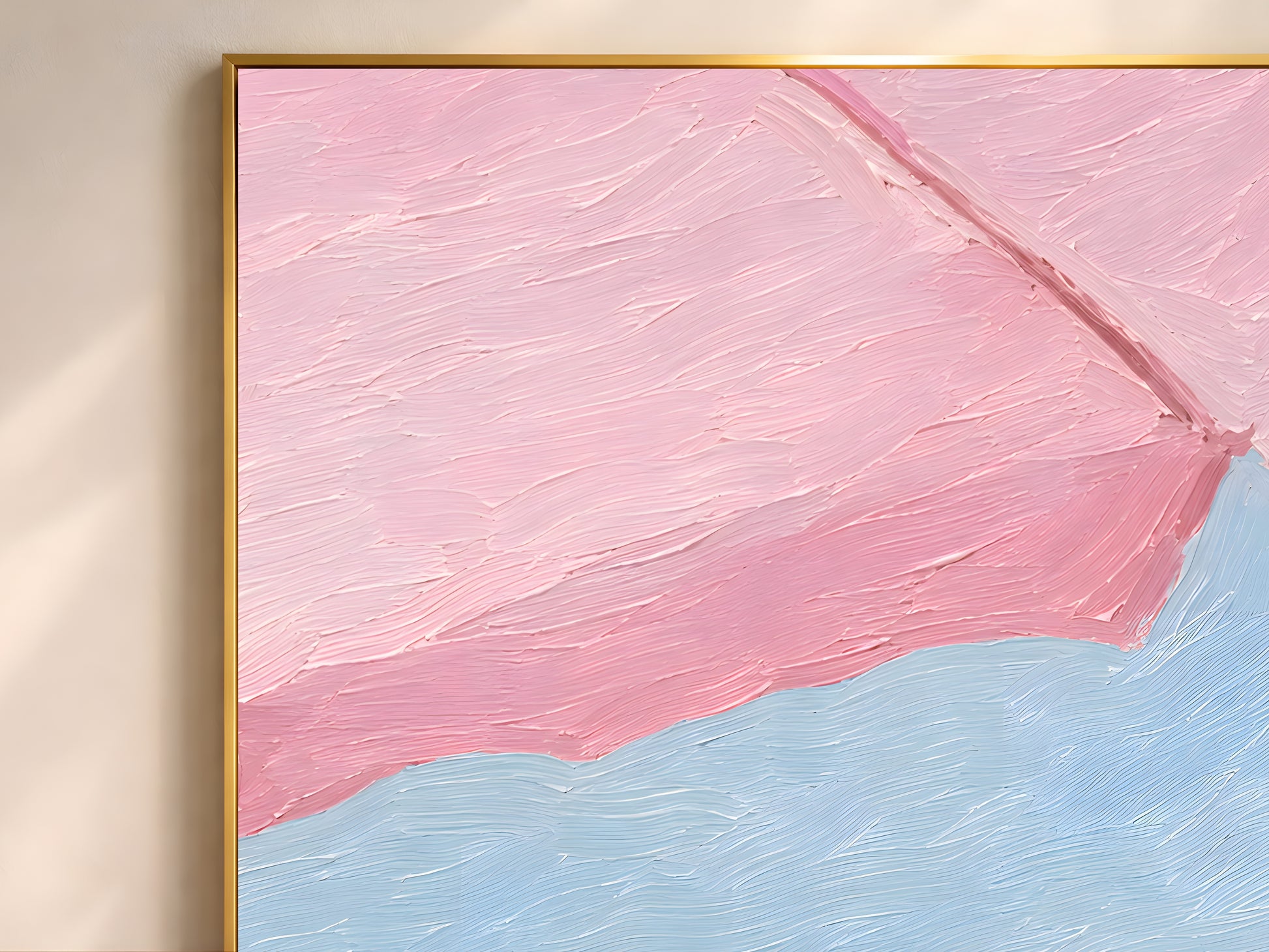 Close-up detail of pink beach umbrella wall art in a gold frame showing thick impasto brushwork in blush pink, rose, and powder blue tones
