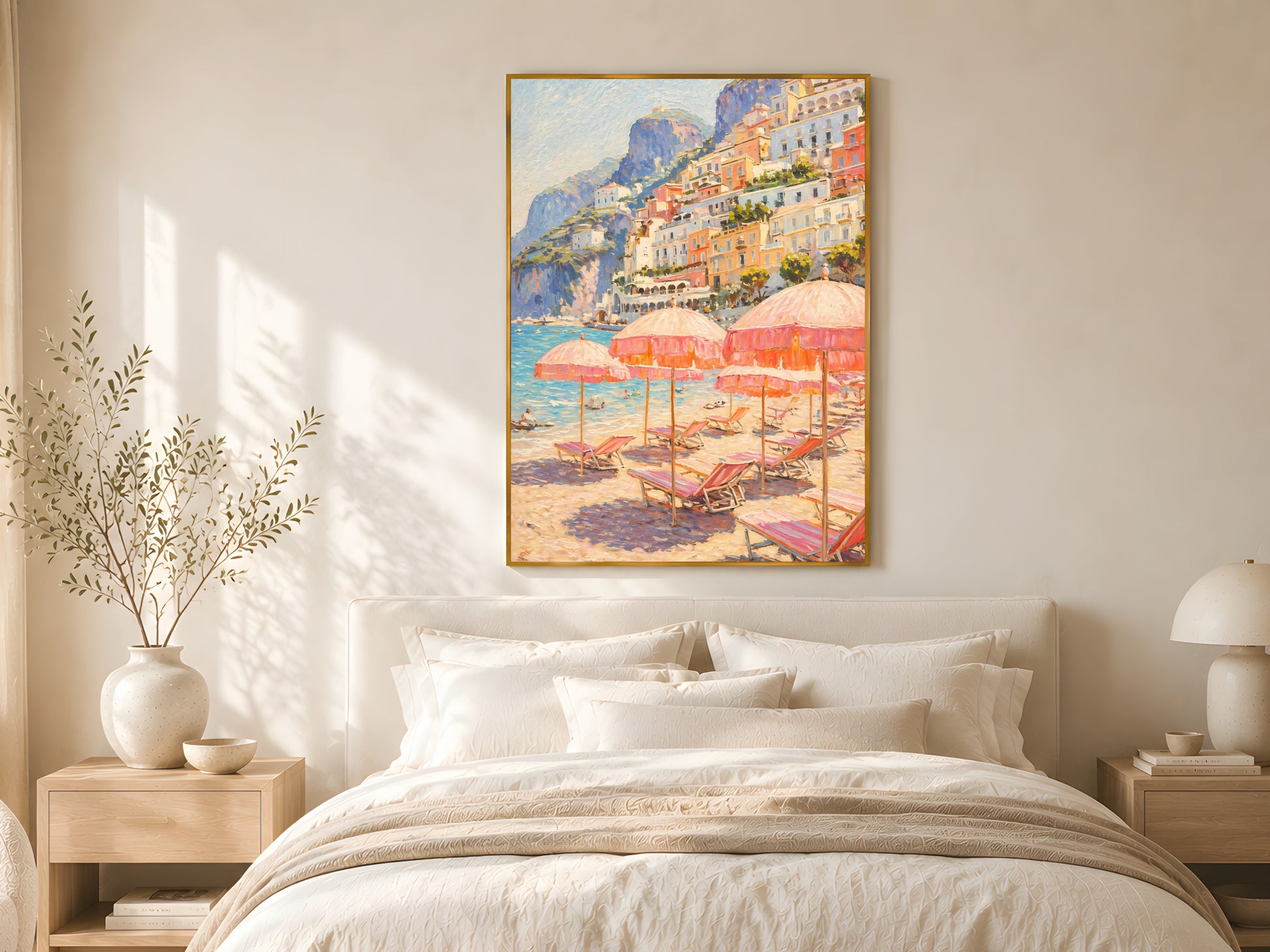 Large Amalfi Coast impasto wall art print in gold frame above linen bed with cream bedding in warm minimalist coastal bedroom
