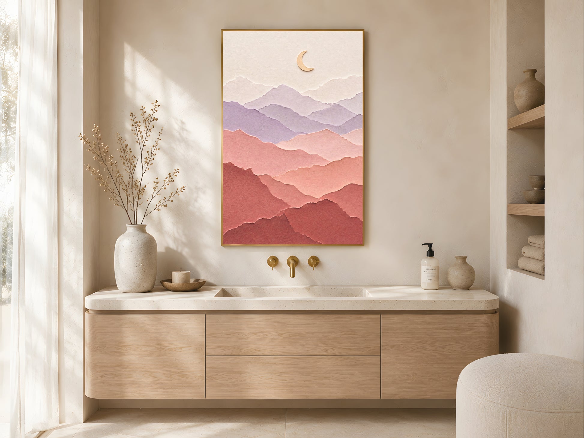 Pastel layered paper art mountain print in a gold frame above a wooden sideboard in a warm minimal bathroom with ceramic vessels and natural light
