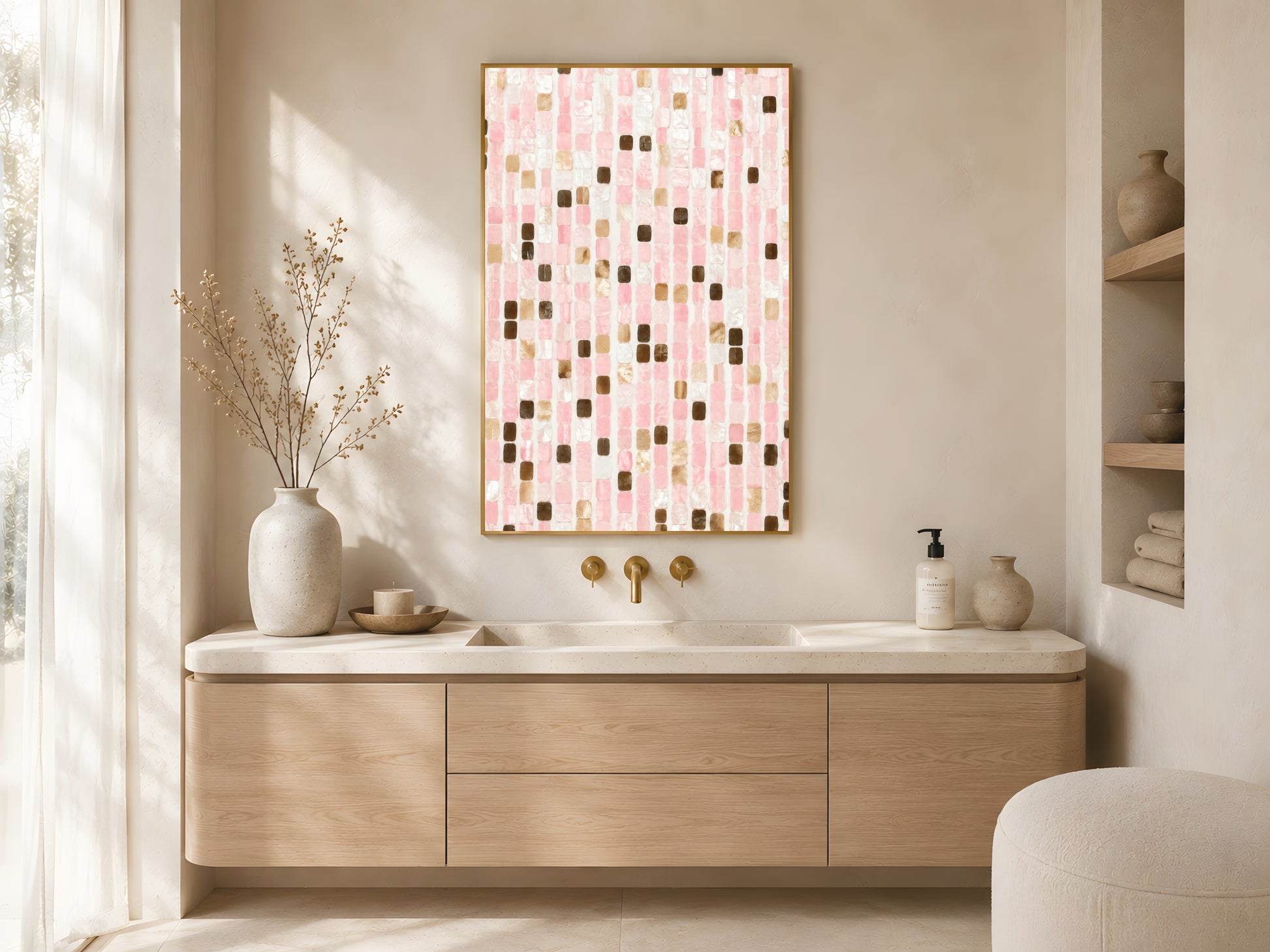 Pink mosaic tile print in gold frame above wooden sideboard in warm minimalist Japandi bathroom with cream vase and soft natural light
