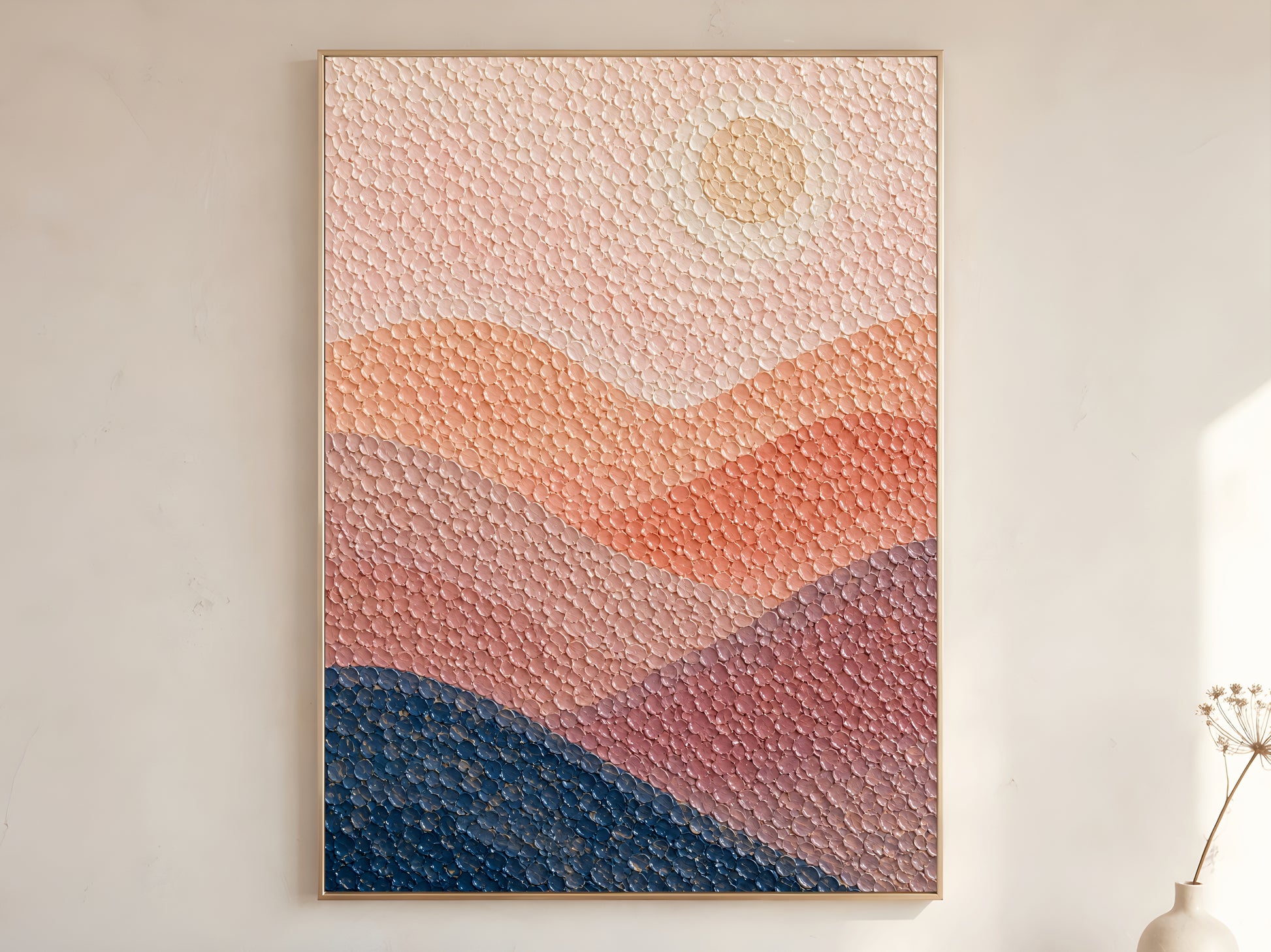 Abstract pointillist sunset ocean print in a wooden frame displaying blush, peach, coral, and navy banded landscape with raised dot texture
