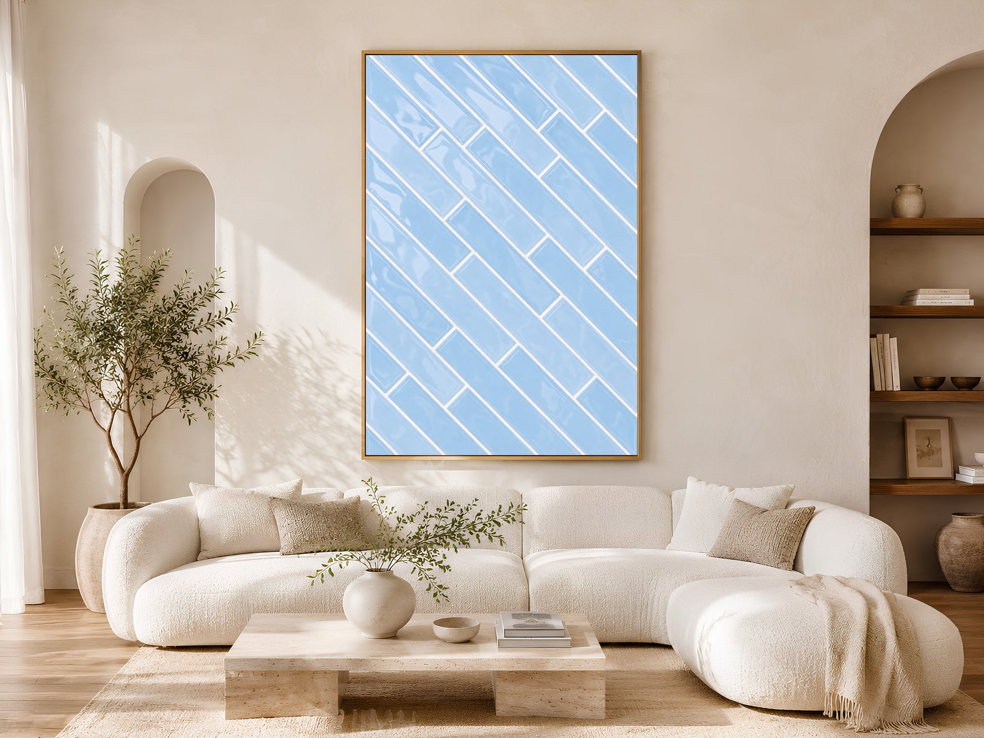 Blue herringbone tile wall art print in a gold frame above a white sofa in a bright Scandinavian living room with a low coffee table and neutral decor
