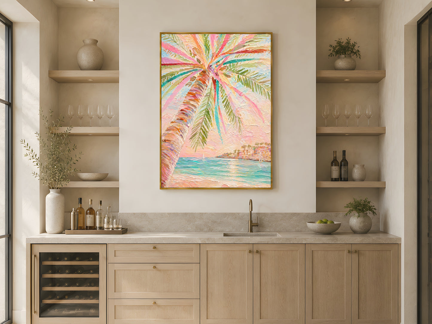 Pastel tropical palm tree impasto print in gold frame above light wood kitchen counter with wine fridge and open shelving in warm Japandi kitchen
