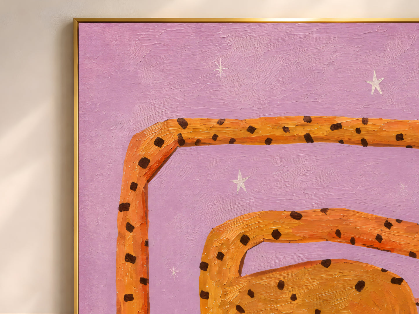 Close-up detail of the impasto giraffe art showing the looping orange spotted neck curving across the lilac starred background
