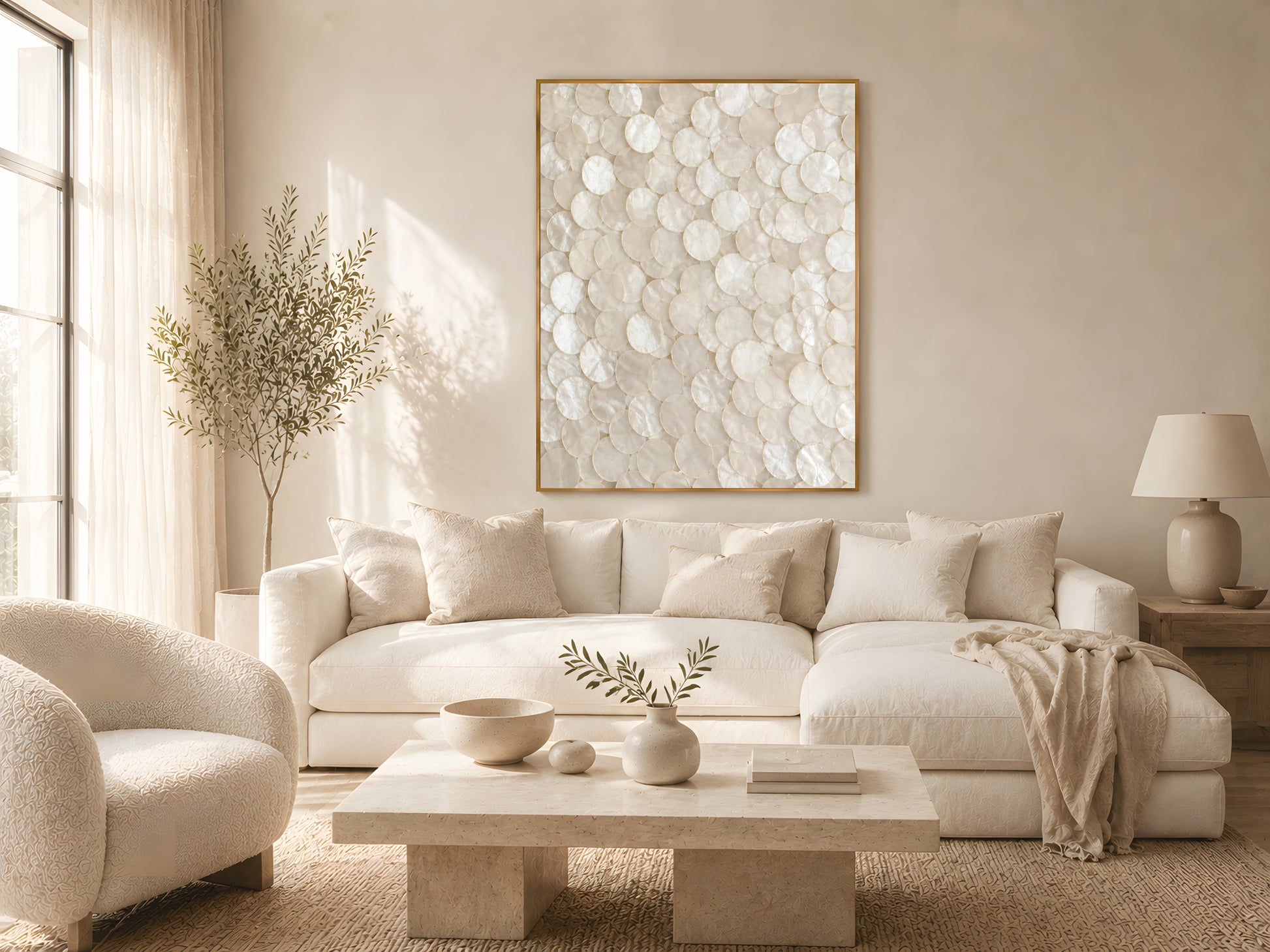 Large pearlescent capiz shell wall art in gold frame above cream sofa in warm minimalist Japandi living room with natural wood coffee table
