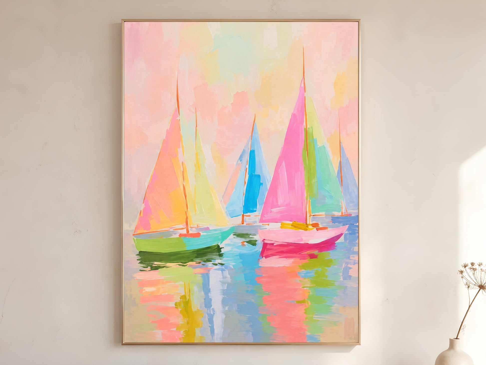 Large framed impasto pastel sailboat wall art in gold frame leaning against white wall with dried botanicals in bright minimal room
