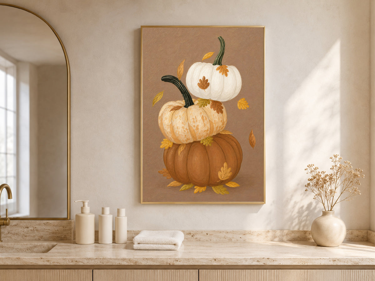 Stacked pumpkin wall art with autumn leaves in a sunlit farmhouse kitchen