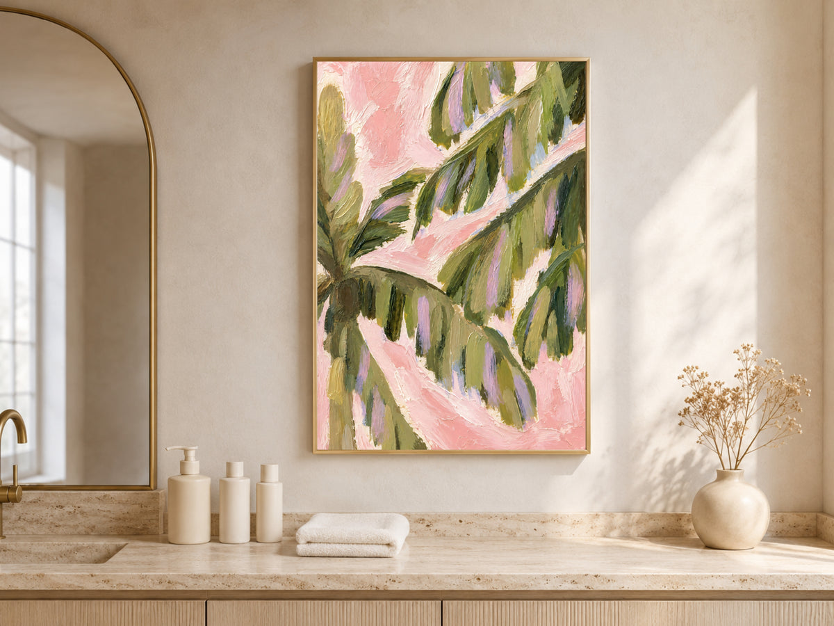 Preppy palm leaf wall art above a bathroom vanity