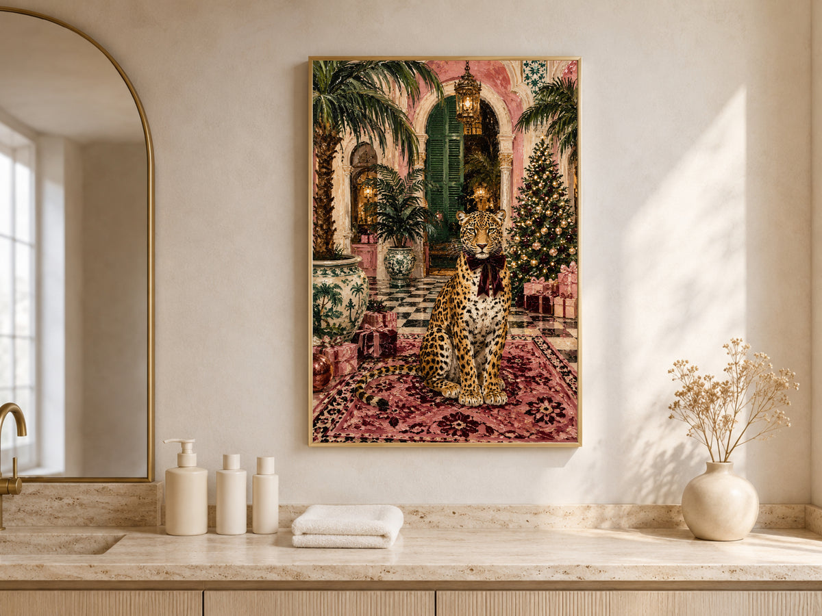 Pink palazzo Christmas painting framed above a bathroom vanity beneath an arched window