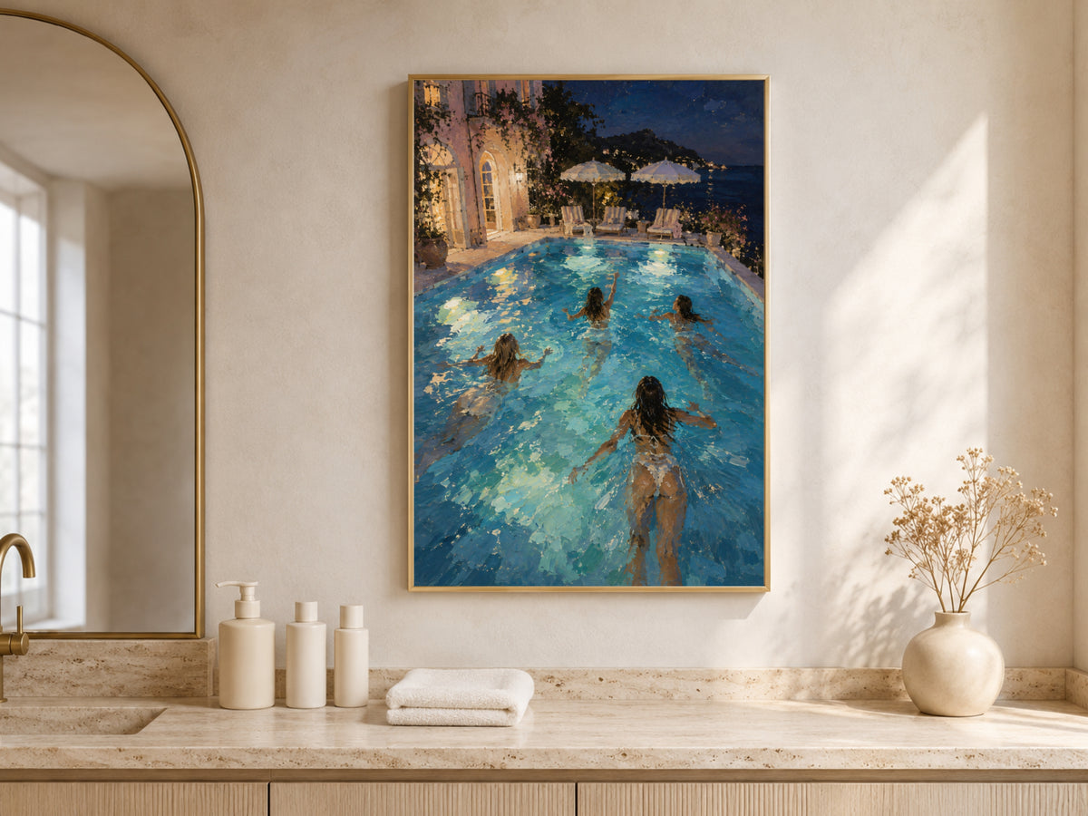 Night swim wall art framed above a bathroom vanity with candles and towels