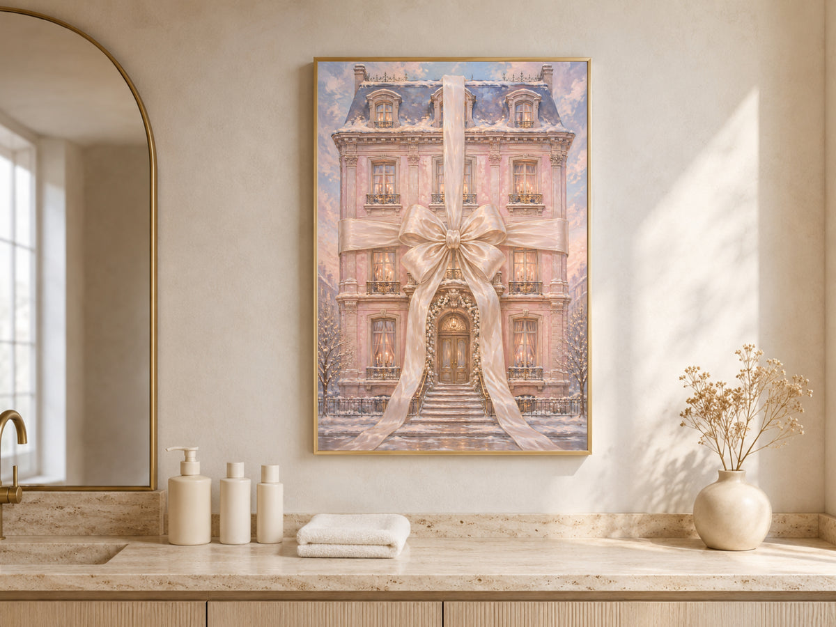Pink chateau Christmas wall art framed above a bathroom vanity with candles and towels