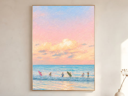 Large framed impasto pastel sunset surf wall art in gold frame leaning against white wall with dried botanicals in bright minimal room
