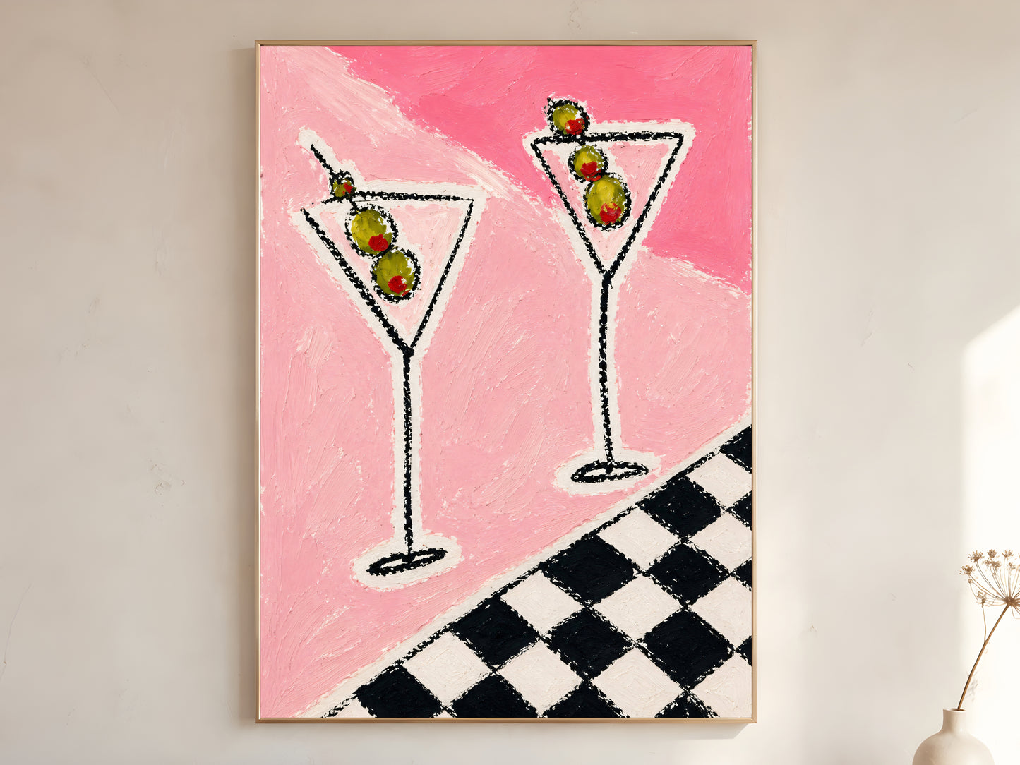 Large framed impasto martini wall art in gold frame leaning against white wall with dried botanicals in bright minimal room
