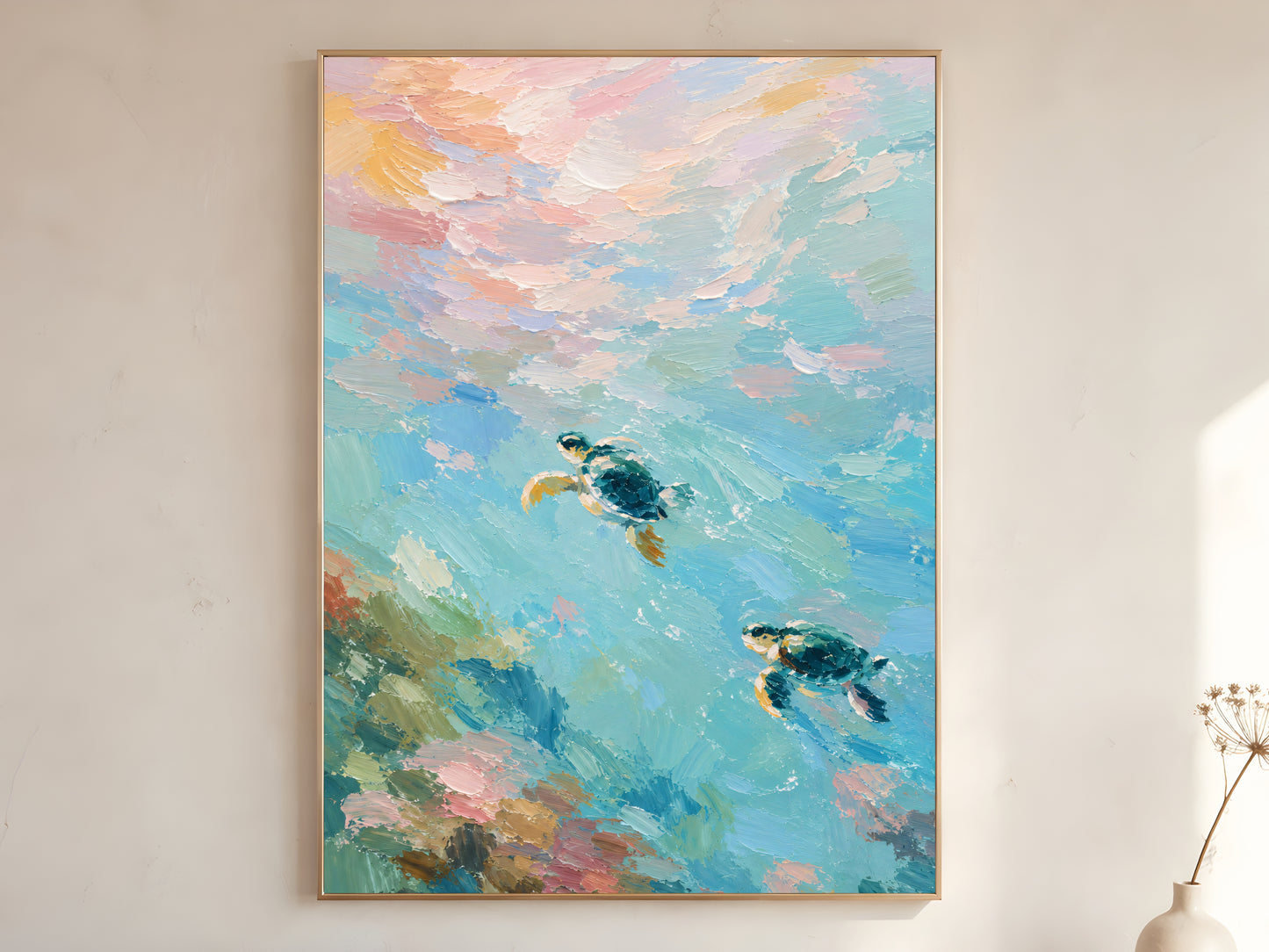 Large framed impasto sea turtle wall art in gold frame leaning against white wall with dried botanicals in bright minimal room
