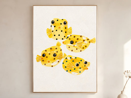 Framed impasto yellow boxfish wall art in gold frame on warm white wall with dried botanicals in bright minimal room
