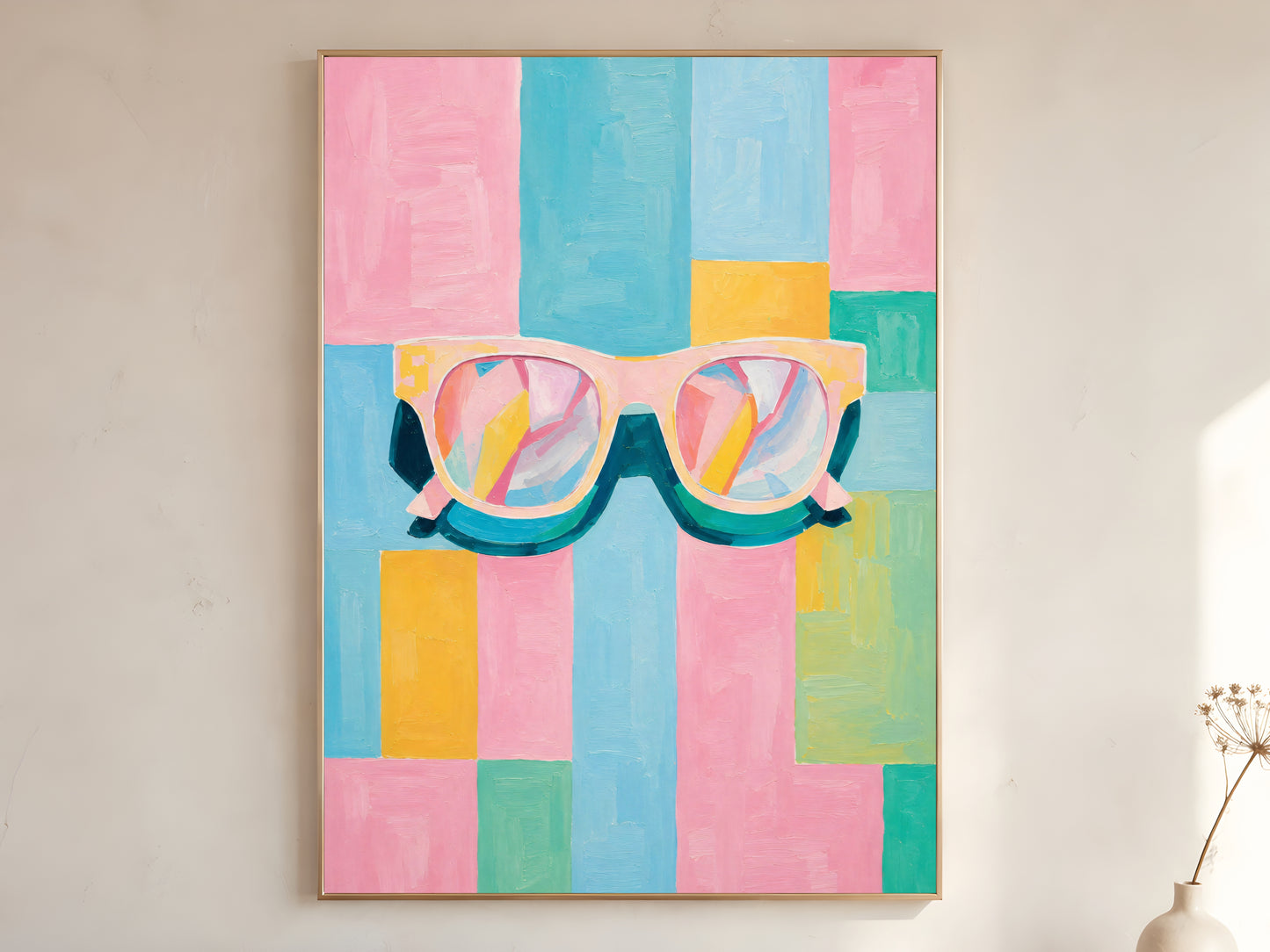 Large framed impasto retro sunglasses wall art in gold frame leaning against white wall with dried botanicals in bright minimal room
