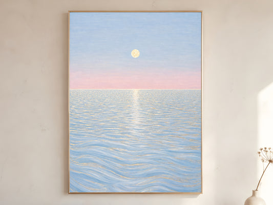 Pastel moon ocean wall art in gold frame on neutral living room wall with vase
