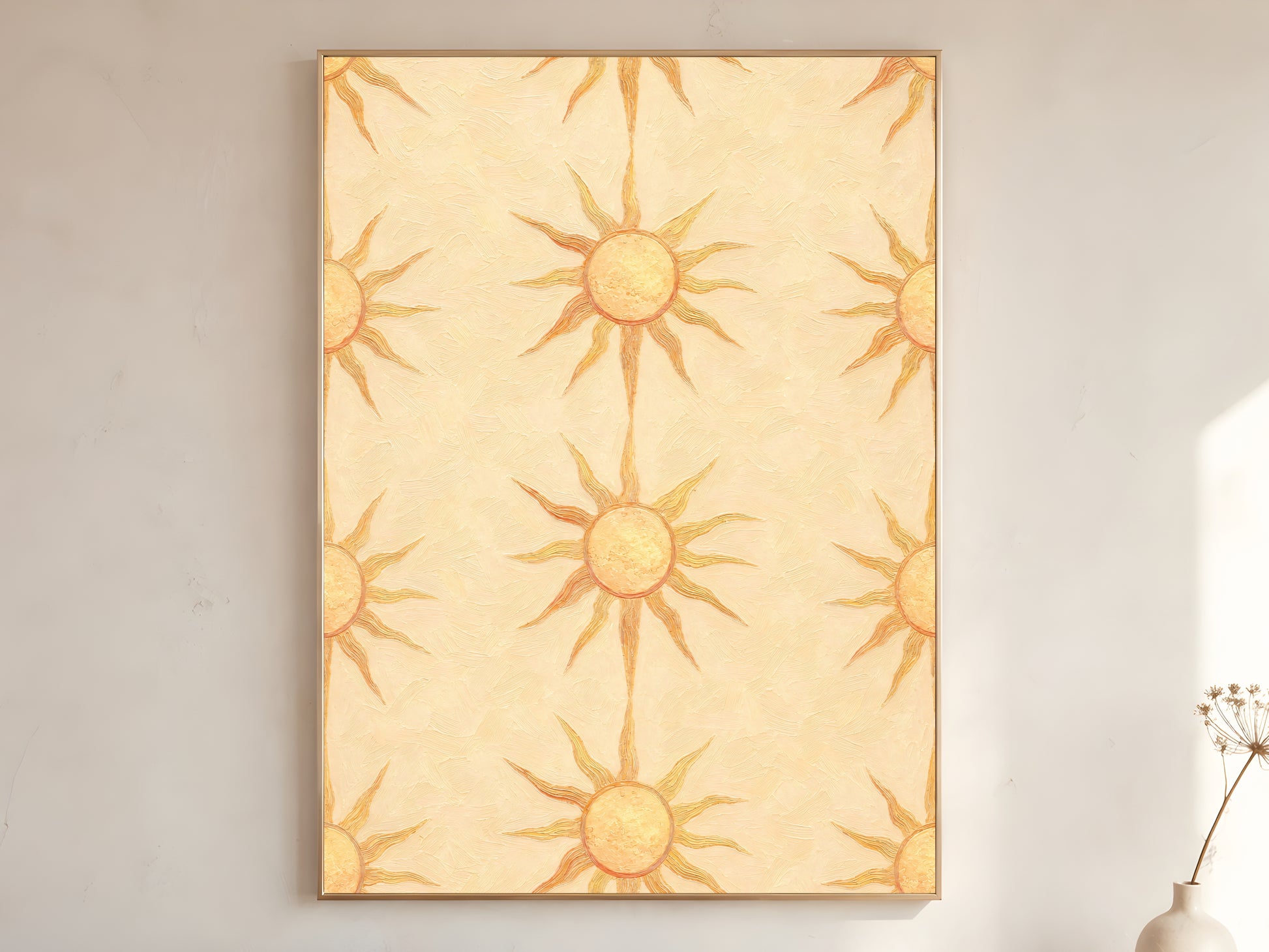 Boho sun wall art print in wooden frame on a cream wall, repeating butter yellow sunburst pattern, with a stoneware vase and dried branches.
