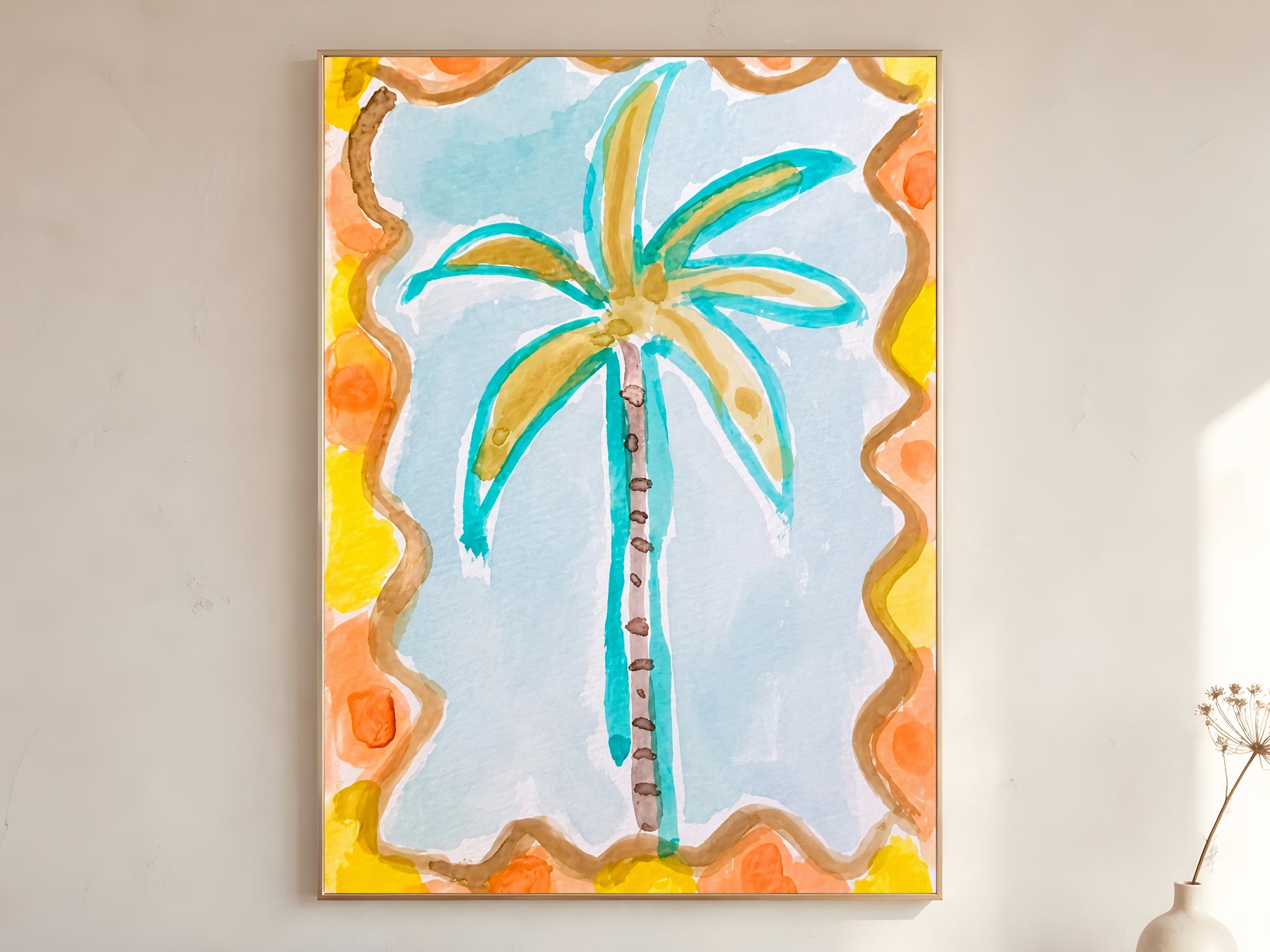 Retro palm tree print in a gold frame leaning against a warm white wall with dried botanicals, showing the full watercolor illustration with teal fronds, amber trunk, and wavy orange and yellow decorative border
