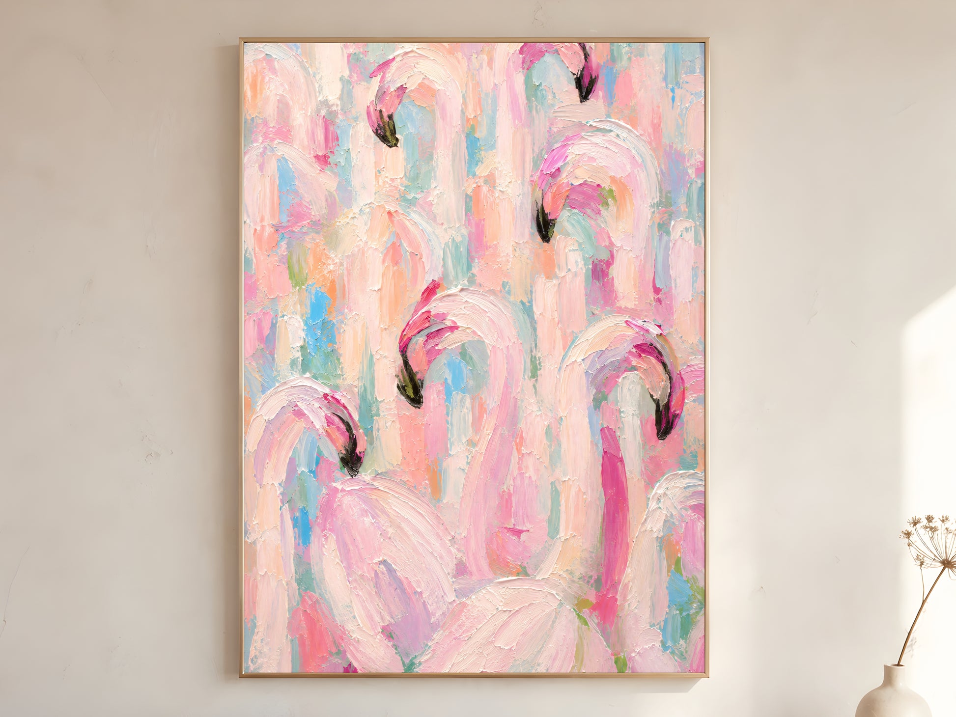 Large framed impasto flamingo flock wall art in gold frame leaning against white wall with dried botanicals in bright minimal room
