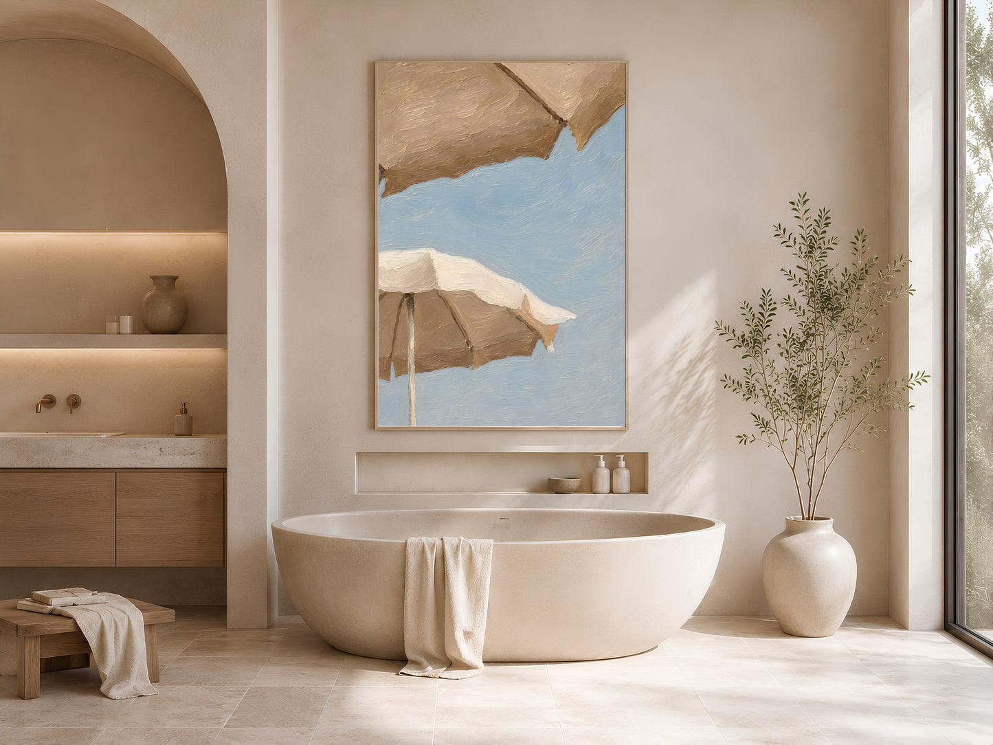 Framed beach umbrella wall art print styled in a serene neutral bathroom with a freestanding bathtub, arched alcoves, and dried botanicals