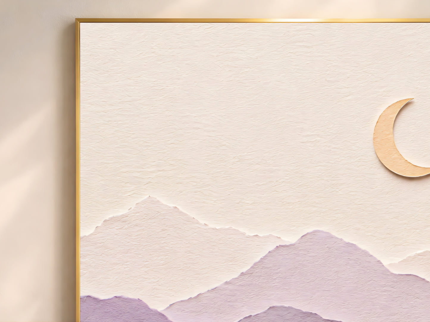 Close-up of pastel layered paper art mountain print showing dusty rose and lavender paper layers with gold crescent moon detail in a gold frame
