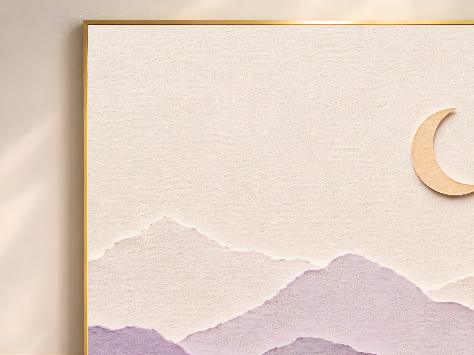 Close-up of pastel layered paper art mountain print showing dusty rose and lavender paper layers with gold crescent moon detail in a gold frame
