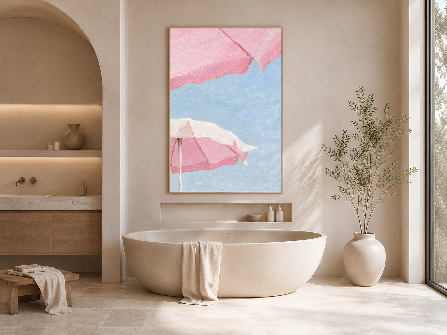 Framed pink beach umbrella impasto print displayed in a serene neutral bathroom with arched alcoves, a freestanding bathtub, and soft natural light