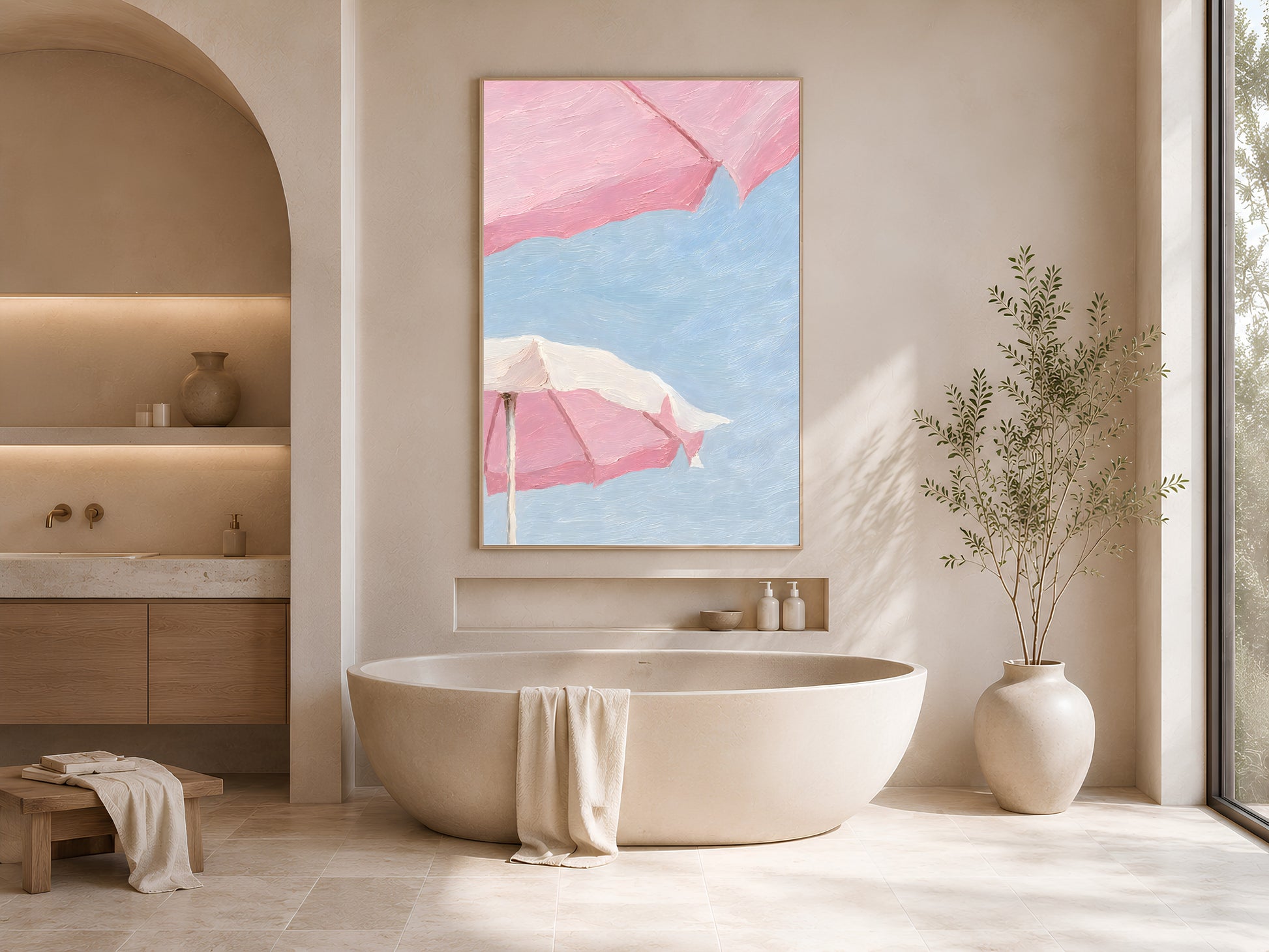 Framed pink beach umbrella impasto print displayed in a serene neutral bathroom with arched alcoves, a freestanding bathtub, and soft natural light