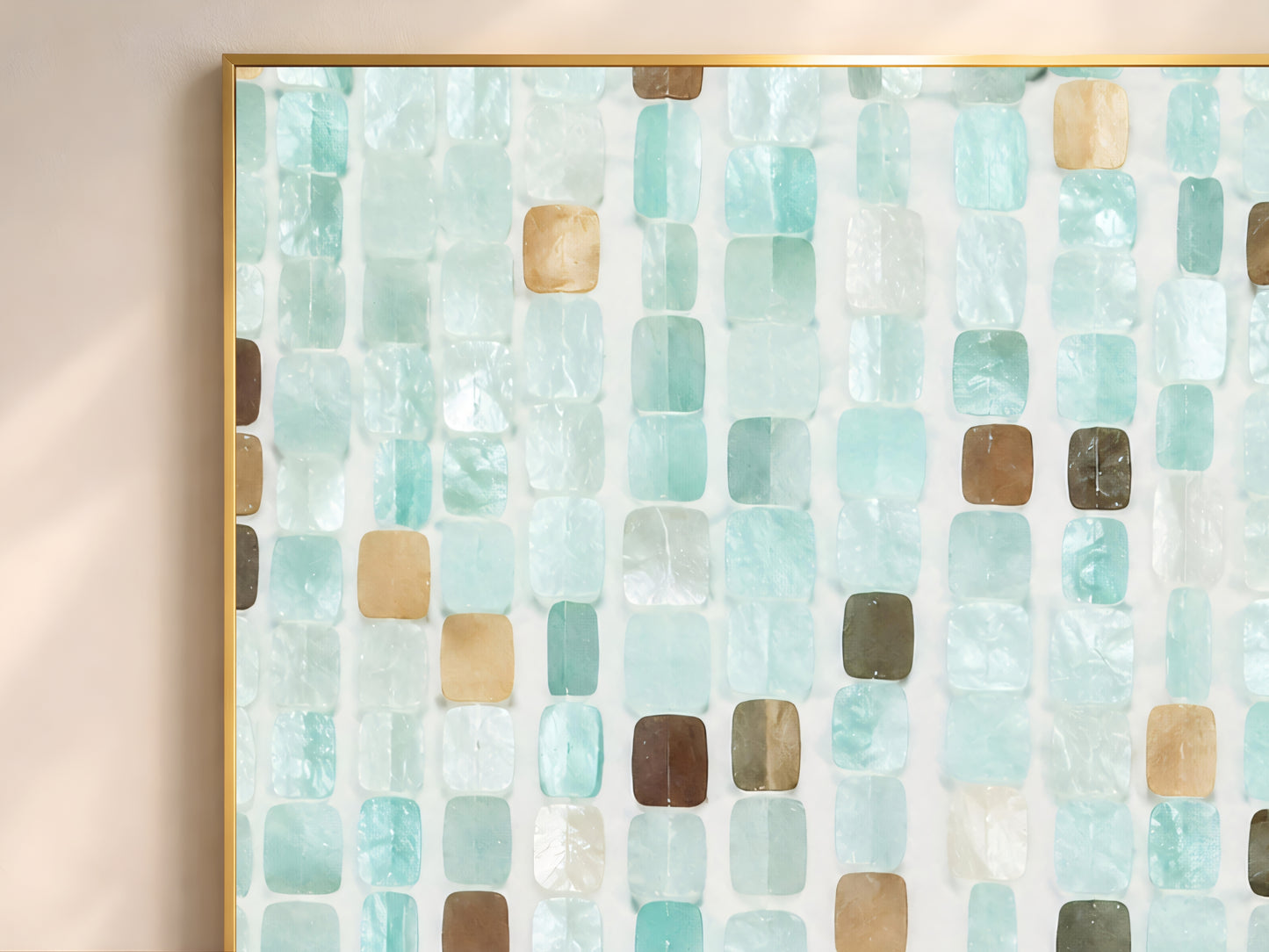 Close-up of teal mosaic tile wall art in gold frame showing soft aqua teal warm sand espresso brown and luminous pearl white tile pieces with Mediterranean texture
