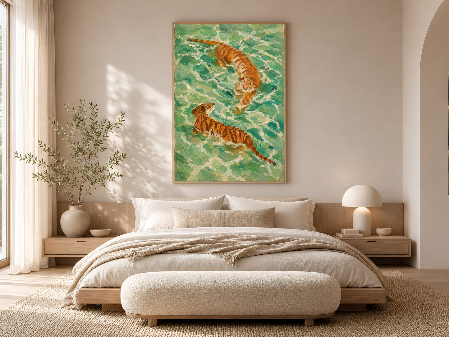Aerial swimming tiger wall art in a gold frame above a low platform bed with cream boucle bedding and warm natural wood bedroom styling
