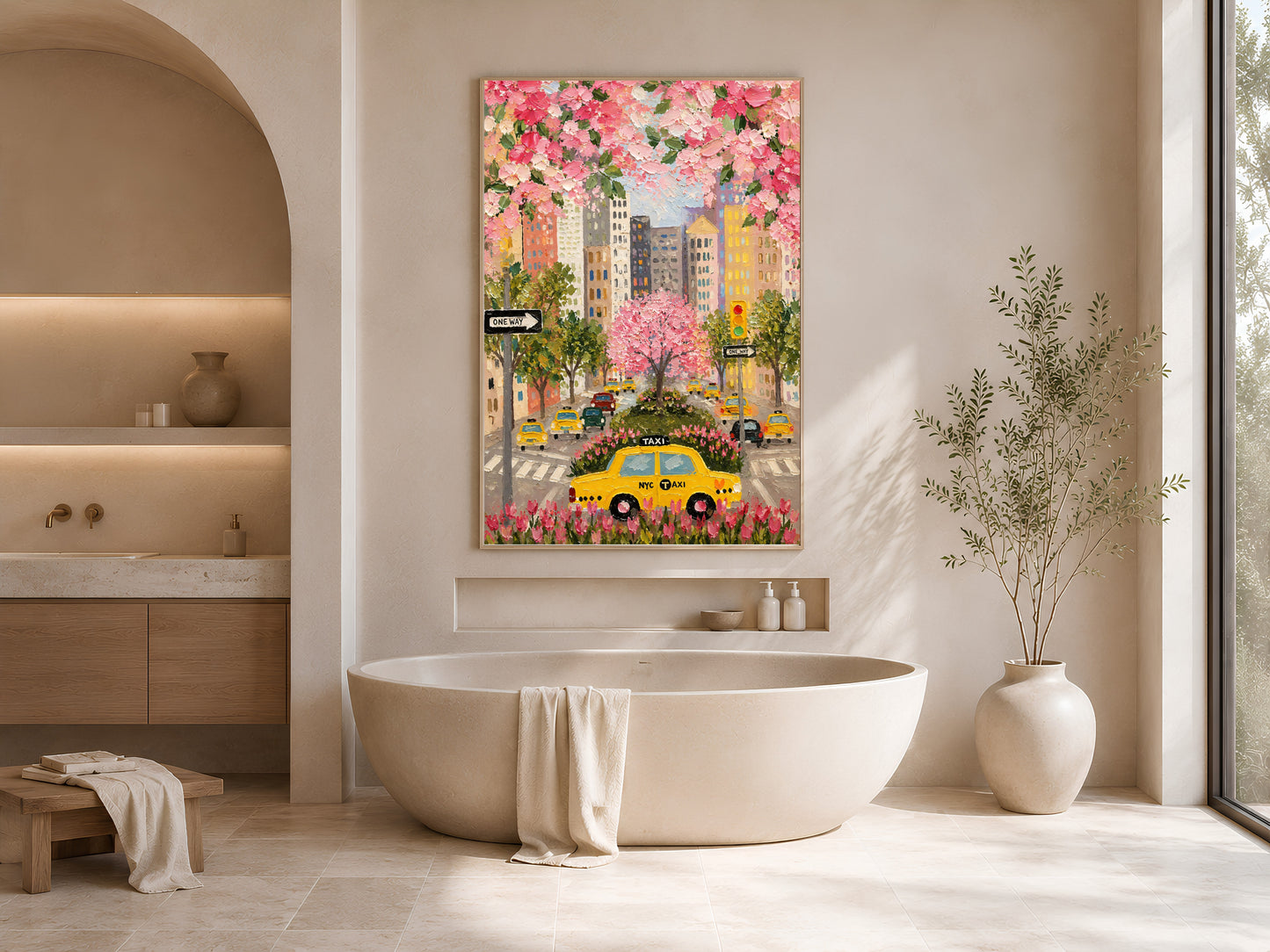 NYC taxi cherry blossom print in gold frame beside freestanding bathtub in bright neutral bathroom with arched niche
