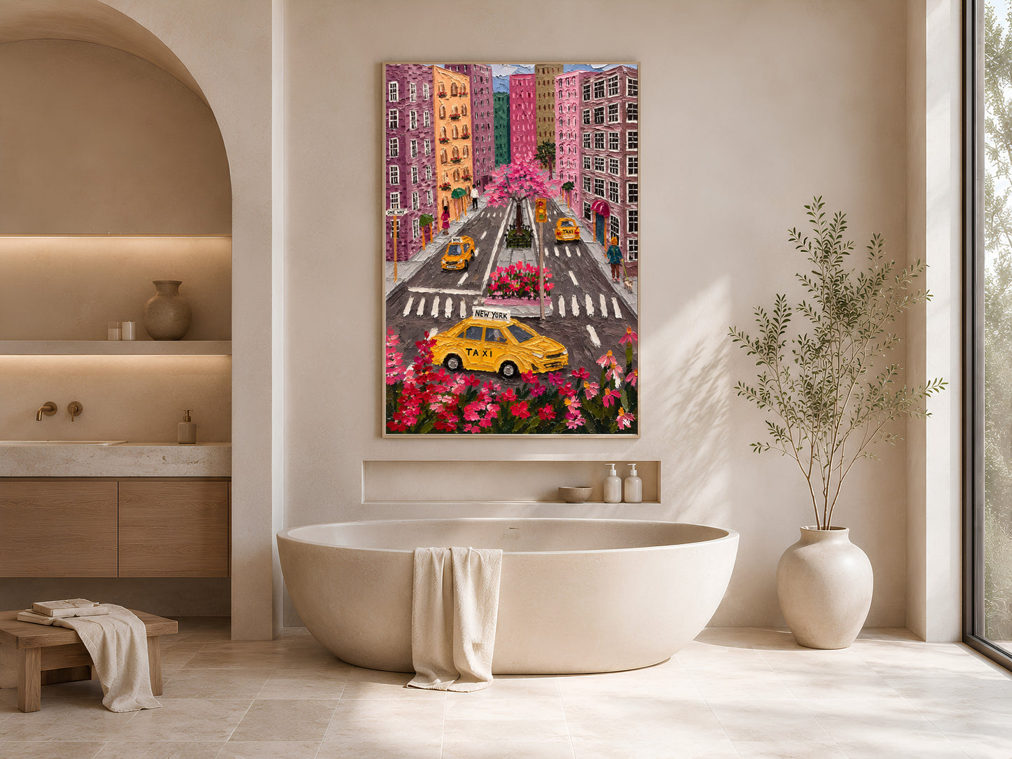 Colorful NYC taxi aerial print in gold frame beside freestanding bathtub in bright neutral bathroom with arched niche

