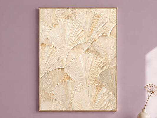 Ginkgo leaf wall art in a gold frame on a mauve wall, styled with a dried flower stem in a vase.
