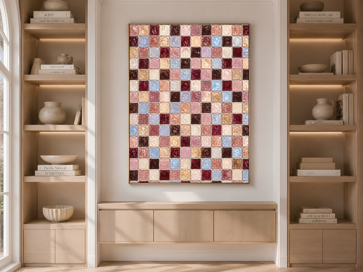 Burgundy mauve mosaic wall art framed on a built-in bookshelf with books and decor