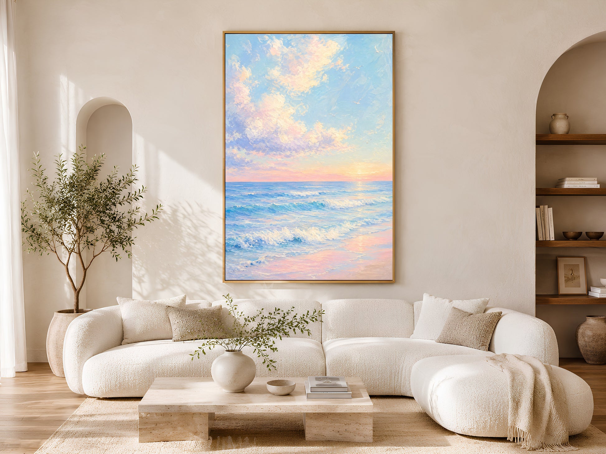 Framed impasto pastel ocean sunrise wall art on warm white wall in minimal living room with curved cream sofa and arch window
