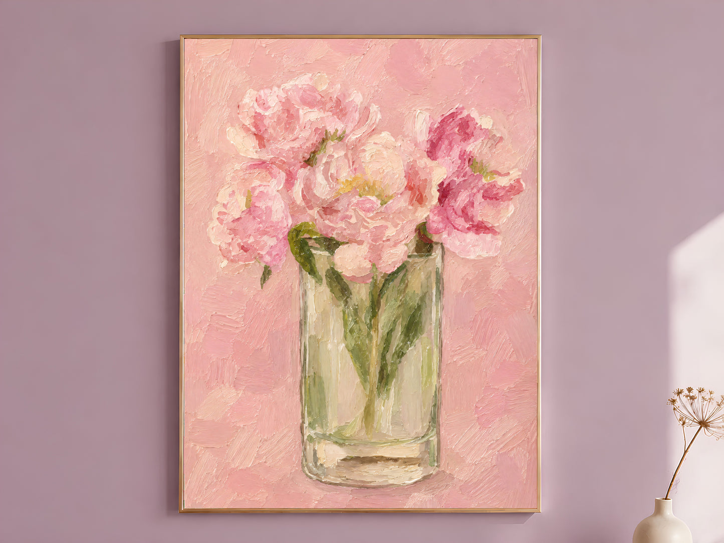 Pink peony wall art in thin gold frame hung on a mauve dining room wall
