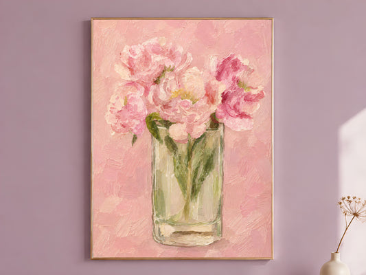 Pink peony wall art in thin gold frame hung on a mauve dining room wall

