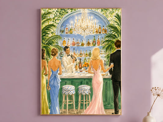Cocktail party wall art print in a gold frame hanging on a dusty mauve wall beside a vase of dried flowers.

