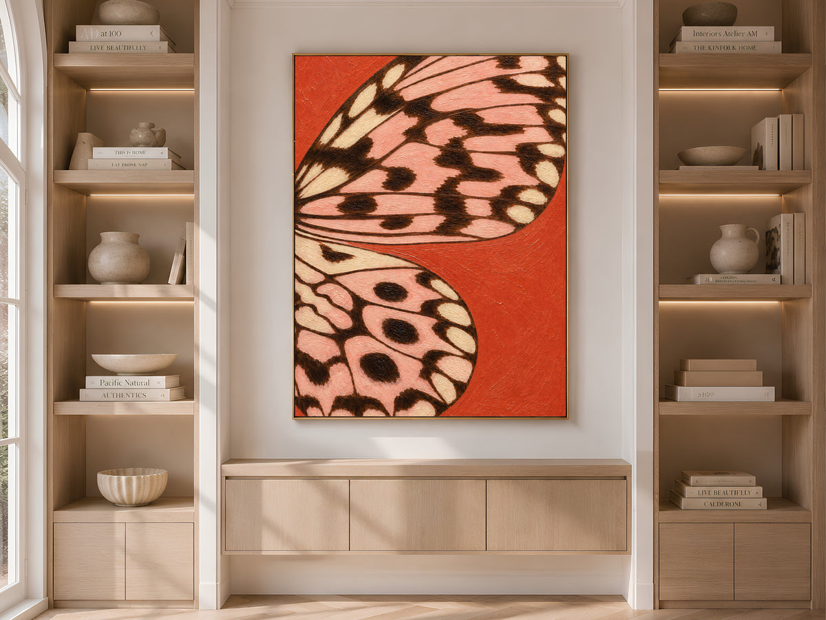 Tomato red and pink butterfly wing print framed on built-in shelving in a neutral living room