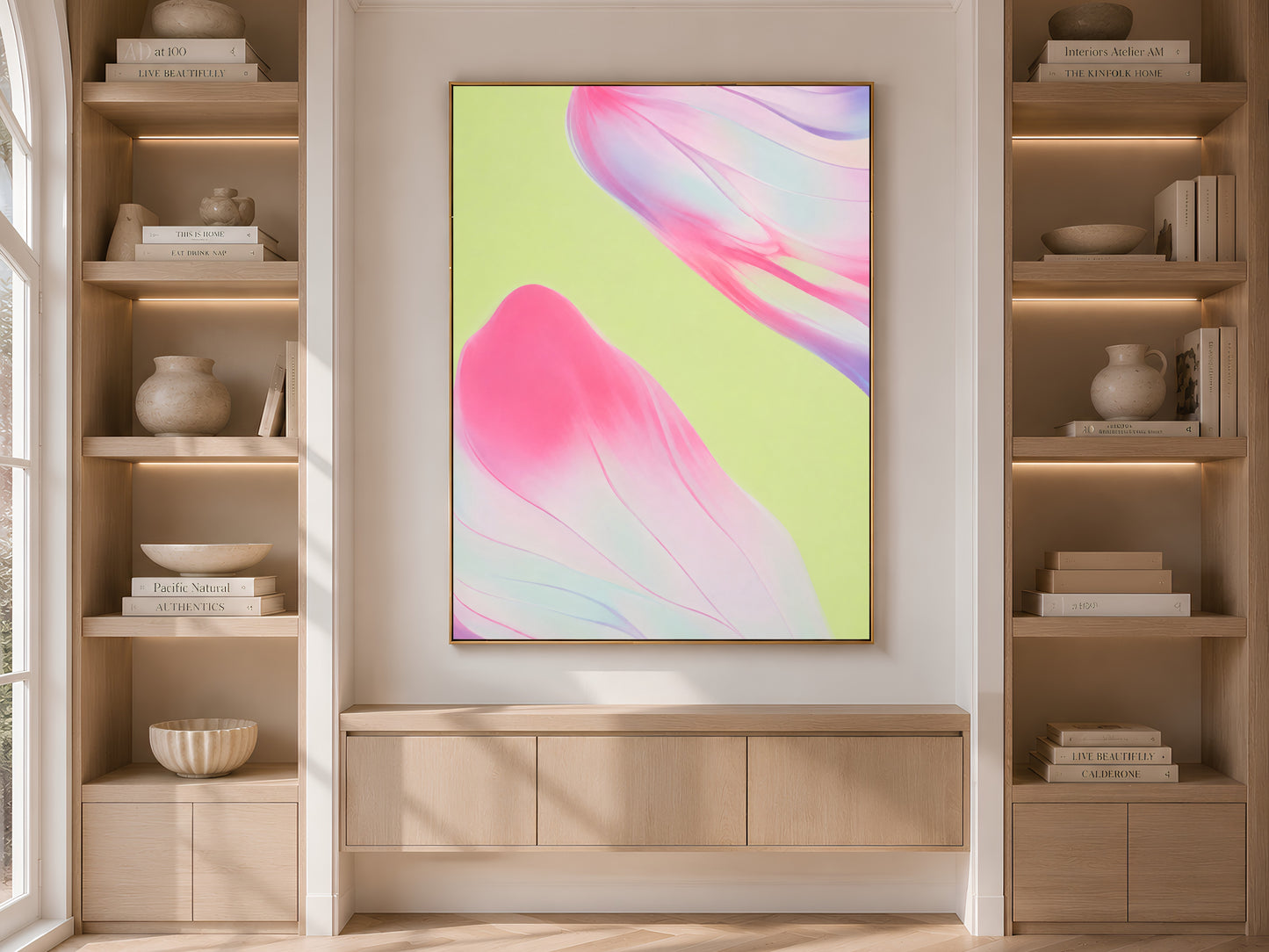 Pink and green abstract art in built-in bookshelf, bold neutral living room decor