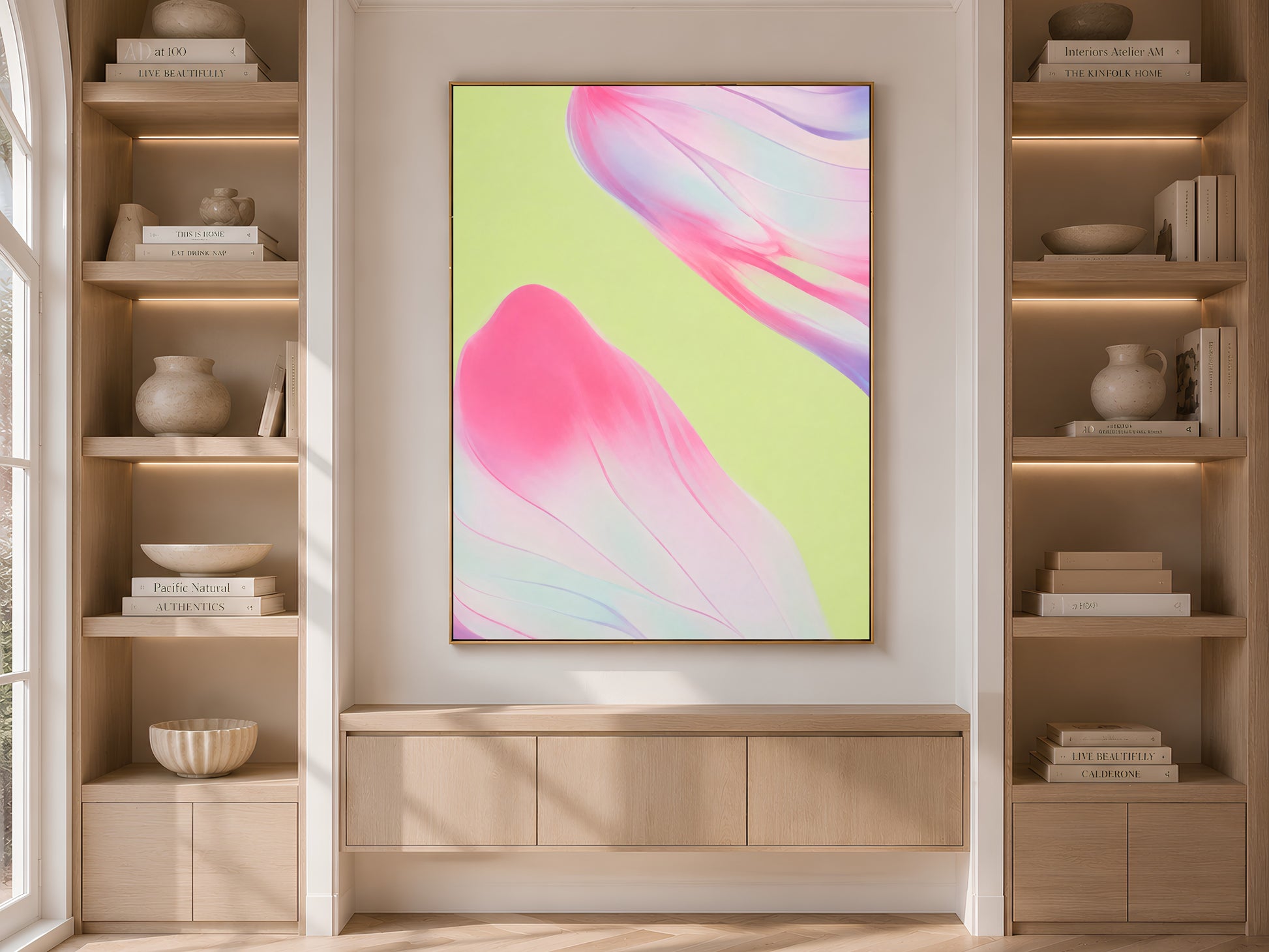 Pink and green abstract art in built-in bookshelf, bold neutral living room decor