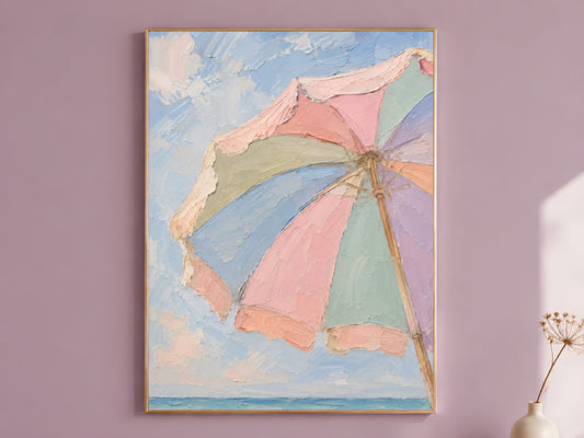 Pastel beach umbrella wall art print in pink sage lavender and blue hanging in dusty mauve room
