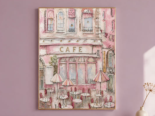 Parisian pink cafe wall art in a gold frame above a mauve wall, impasto painting of a storefront with striped awnings and bistro tables