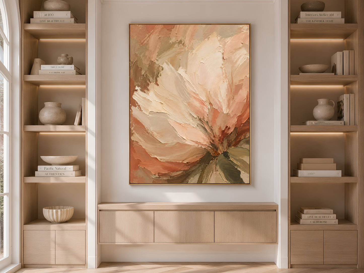 Terracotta peony wall art print displayed above a built-in cabinet between wooden bookshelves